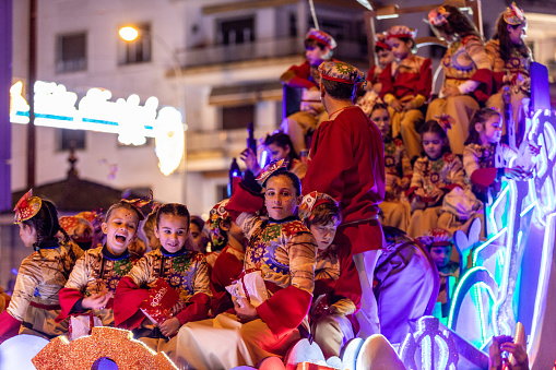 Sevilla, Spain 01-06-2024 Los Reyes Magos (Three wise men) parade in Sevilla in the evening. The parade is a start to the magical night for kids, when the kings come to their houses to bring presents.