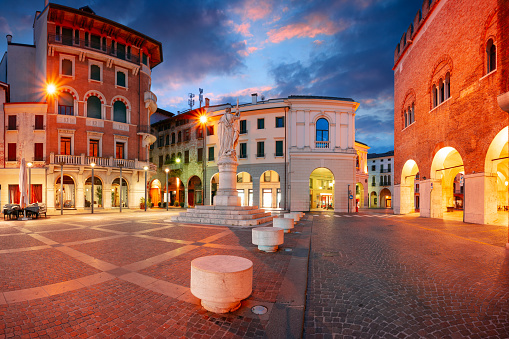 Cityscape image of historical centre of Treviso, Italy with old square at sunrise.