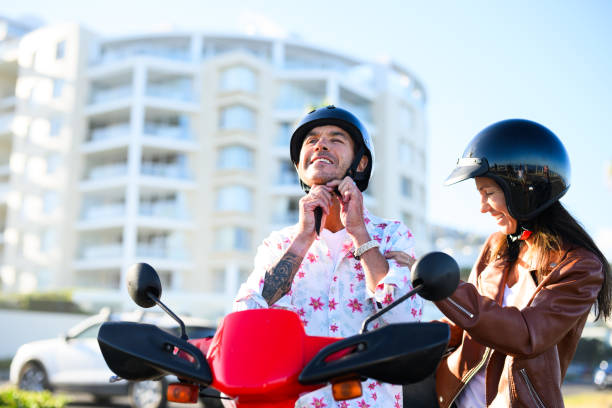 istock Couple climbing on scooter getting ready for adventure 1937343022