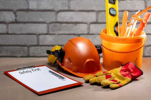 istock Safety equipment, tools and check-list with text SAFETY FIRST. safety first, construction concept. 1937352799
