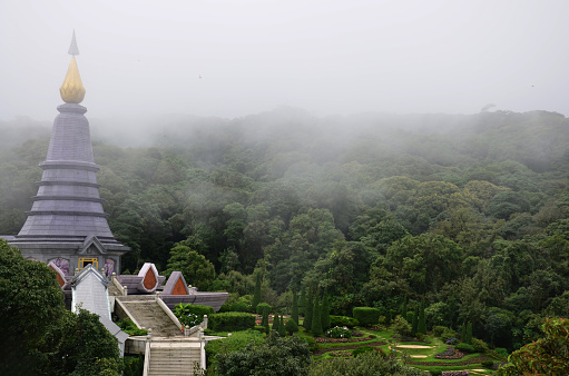 Naphamethinidon chedi and Naphaphonphumisiri pagoda stupa of Doi Inthanon mountain with mist rainning in morning for thai people travelers travel visit at Doi Luang or Ang Ga in Chiang Mai, Thailand