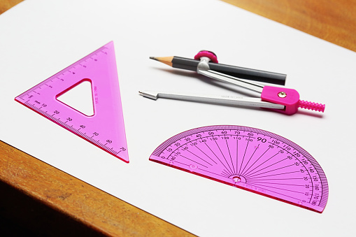 Modern math set in feminine shades of pink, representing geometry for girls.
