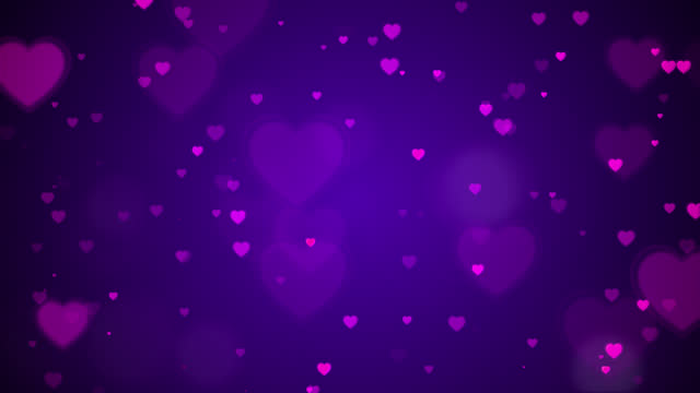 Hearts and bokeh on purple background.