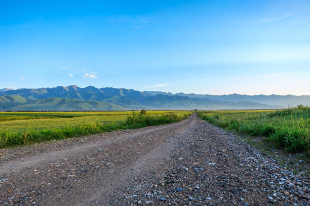 istock Country road and mountain background 1937392446