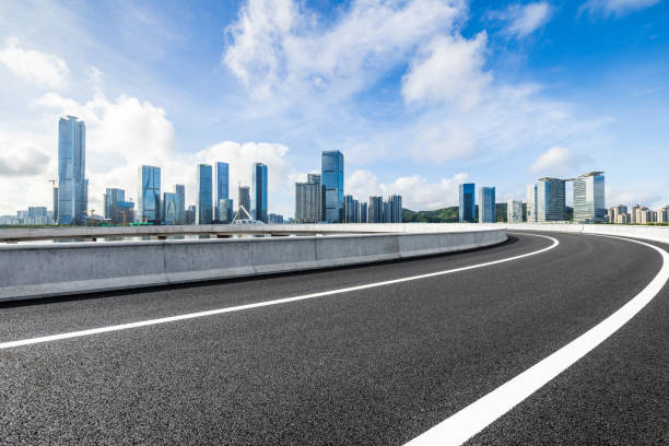istock Asphalt highway and city skyline with modern buildings under blue sky 1937395703