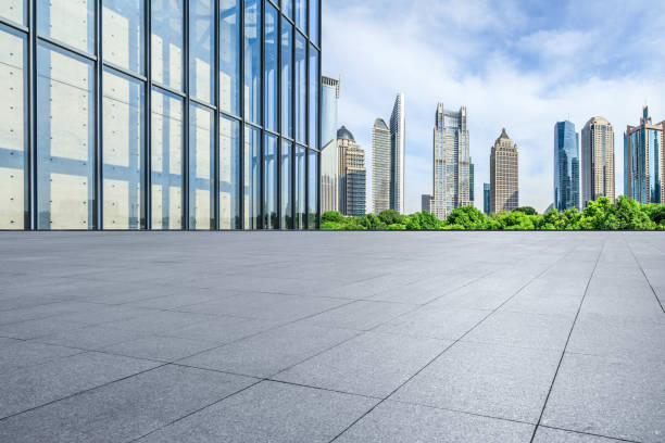 istock Empty square floor and glass wall with modern building in Shanghai 1937395704