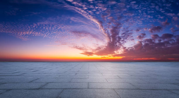 istock Empty square floor and spectacular sky with clouds at sunset 1937398553