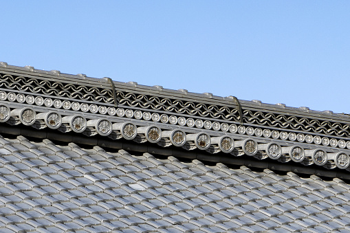 Kyoto, Japan - October 10th, 2023:  A Close-Up of  Traditional Ornate Japanese Roof Tiles