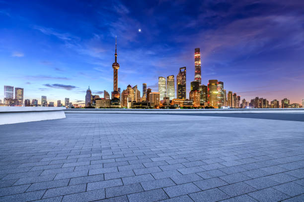 istock Empty square floor and modern city building scenery at night in Shanghai 1937408543