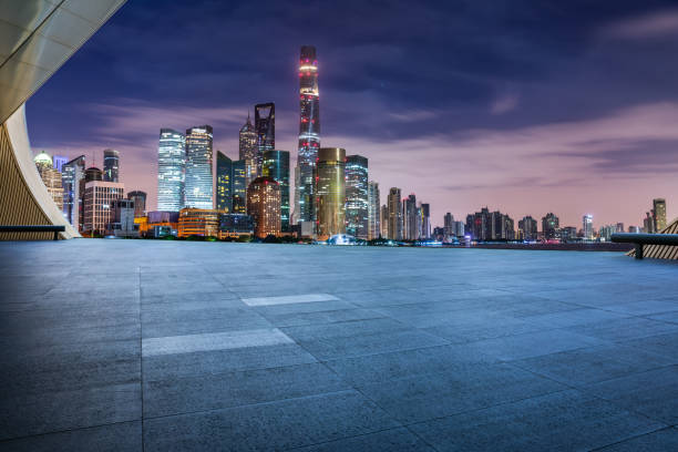 istock Empty floor and modern city building scenery at night in Shanghai 1937413041
