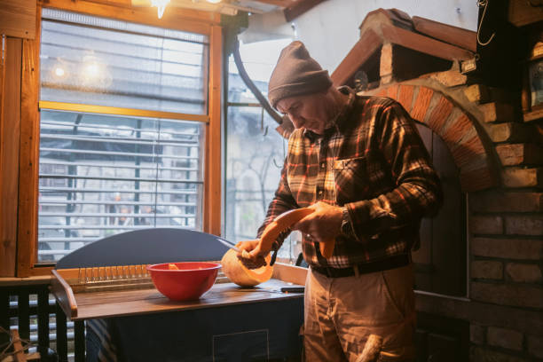 istock Removing pumpkin's crust with a knife 1937430851