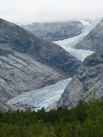 View of an outgoing glacier with an icefall in Norway.