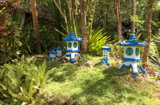 Photo of View of an Asian garden with decorative elements and small decorative pavilions