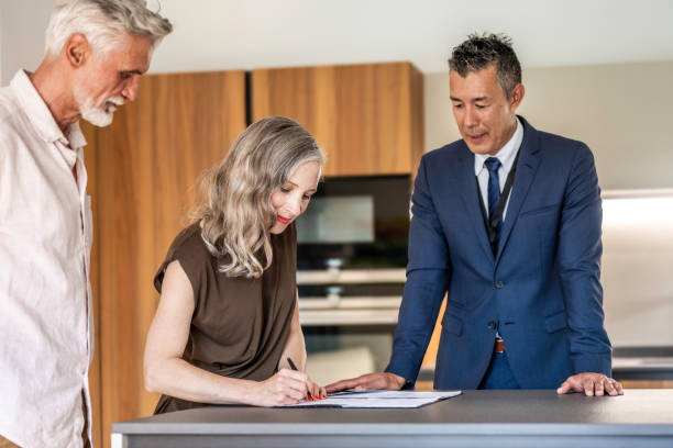 istock Couple signing house leasing agreement 1937435219