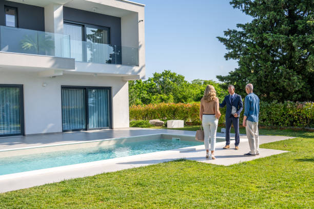 istock Real estate agent showing house 1937435222