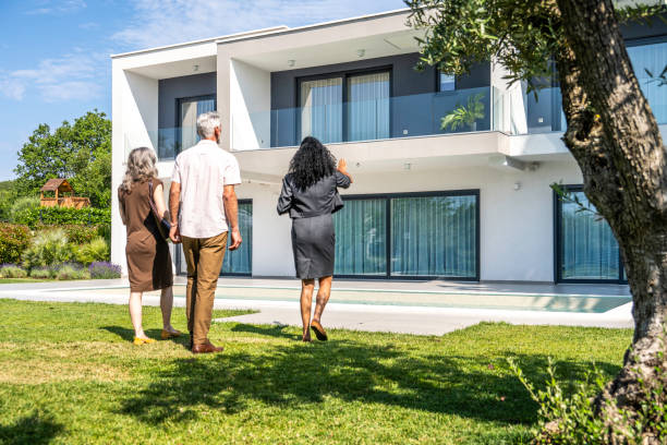 istock Real estate agent showing luxury house 1937435234