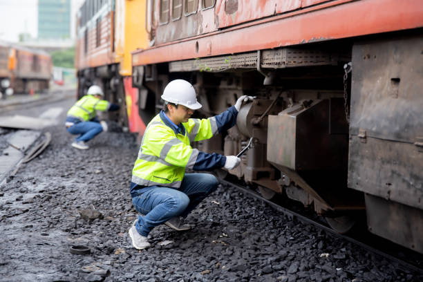 istock Young caucasian engineer man maintenance and repair train diesel engine in station, team engineer inspect system transport, technician checking infrastructure, transportation and industry. 1937438664