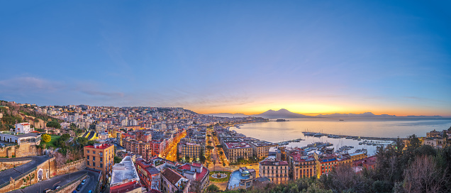 Naples, Italy aerial skyline on the bay with Mt. Vesuvius at dawn.