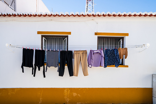 Drying the cloths in front of traditional Alentejo house in Almodovar, Portugal
