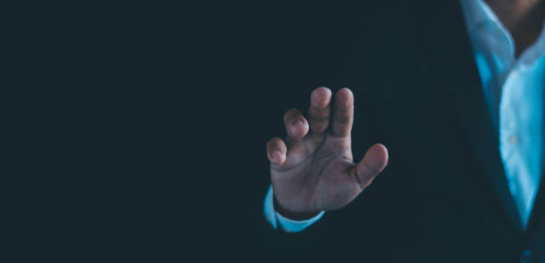 istock Businessman working and holding out his hand showing working hand gesture 1937451091