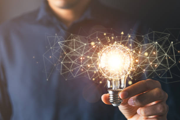 istock Businessman holding light bulb symbolizing creative idea and strategic thinking in business.Creative solution and idea concept. 1937458829