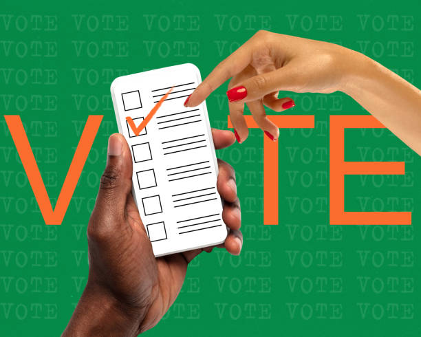 istock Online voting system. Human hand holding phone with ballot paper on screen with checkmark. Contemporary art collage 1937464485