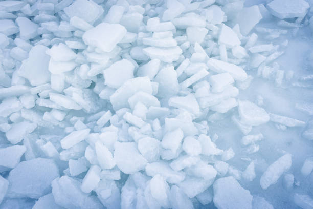 winter season, natural landscape background: broken ice floes on the surface of the water in winter on the river