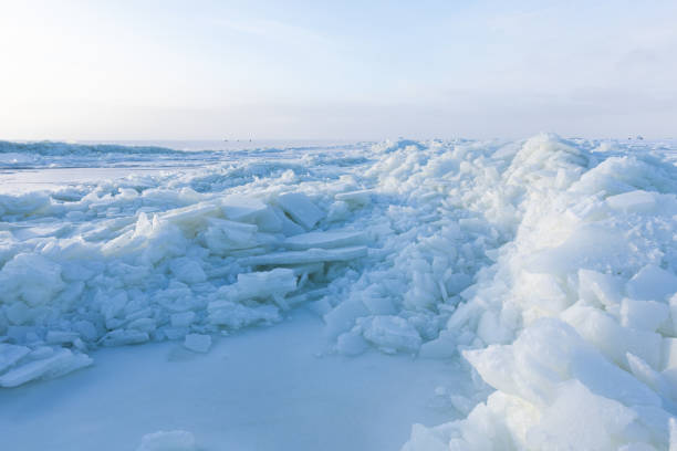 istock Winter landscape photo. Ice hummocks covered with snow 1937466100