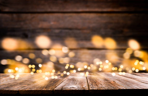 istock Empty rustic wooden table with blurred glitter lights background. Christmas lights on empty wooden table. Xmas holidays wallpaper. 1937470967
