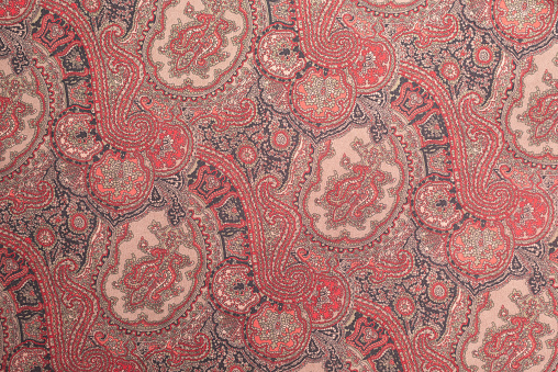 Burgandy paisley textile, fabric pattern background