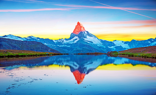 Fantastic landscape with the beauty illuminated by the top of the mountain Matterhorn in the morning sun in the Swiss Alps and Lake Stellisee, near Zermatt, Switzerland. Amazing placec. (harmony, meditation - concept)