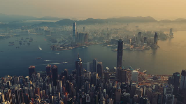 Aerial forward Hong Kong cityscape at sunrise