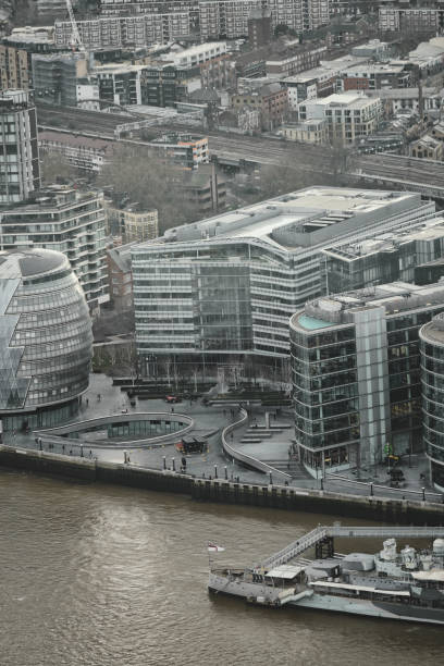 hms belfast - greater london's iconic buildings by the river thames, london's city hall (southwark), more london, potters fields park, urban skyline, aerial view cityscape, england, united kingdom, britain. - tower london england greater london inner london imagens e fotografias de stock