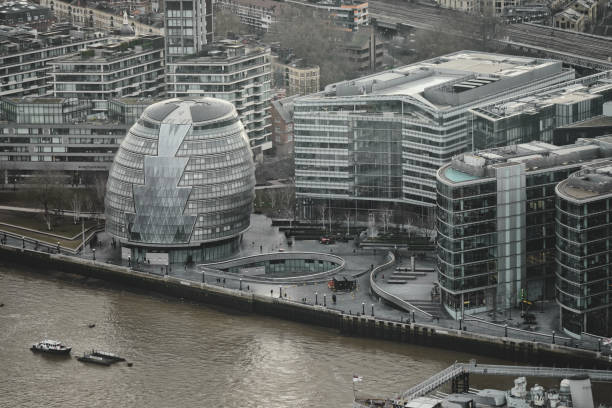 hms belfast - greater london's iconic buildings by the river thames, london's city hall (southwark), more london, potters fields park, urban skyline, aerial view cityscape, england, united kingdom, britain. - tower london england greater london inner london imagens e fotografias de stock