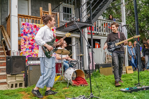 Somerville, MA, US-May 13, 2018: Local music festival, Porchfest attracts crowds to neighborhoods all over town to listen to local music.
