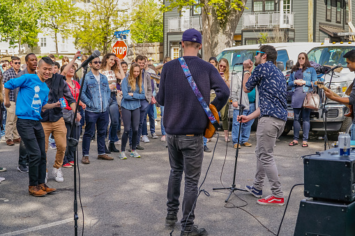 Somerville, MA, US-May 13, 2018: Local music festival, Porchfest attracts crowds to neighborhoods all over town to listen to local music.