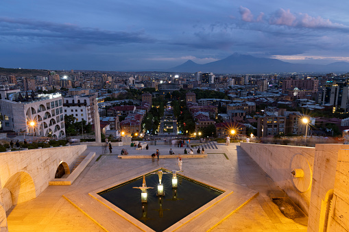 Panoramic landscape night scene of Yerevan capital of Armenia city with lights and mount Ararat in background