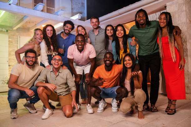 istock A Diverse Friend Group Smiling At The Camera While Posing For A Group Photo At A Backyard Party 1937537247
