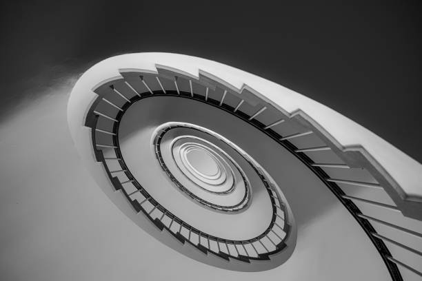 istock Low angle view of spiral staircase 1937541584