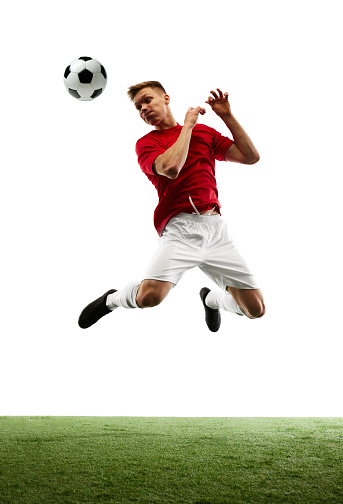 Sculpting victory in air. True artist on soccer field, footballer executes perfect pass against white background with green field. Concept of sport games, hobby, energy, world cup season, movement. Ad