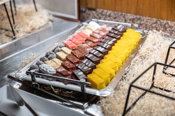 istock Sliced fresh homemade cakes on a tray at a wedding reception. 1937549965
