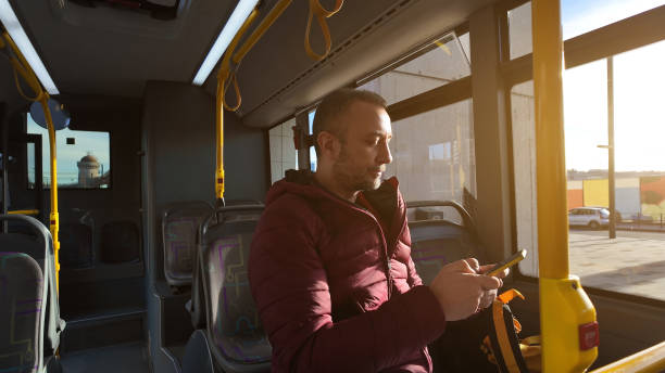 istock Commuter inside a bus at city station. 1937550166