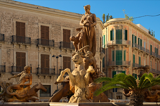The Fountain of Diana (Fontana di Diana) is in the center of Piazza Archimede in Syracuse on the. It is also known as the Fountain of Artemis, as the original Greek name. Travel and tourism concept.