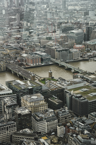 East Central London, England, United Kingdom, Great Britain - January 08th, 2024. London Bridge (located at EC4R 9HA), Cannon Street Railway Bridge (originally opened in 1866) & River Thames aerial photo was captured in the daytime in winter.

Captured in January 2024, this daytime aerial photo showcases the iconic River Thames panorama, featuring prominent landmarks such as London Bridge and Cannon Street Railway Bridge. 

The City of London / East Central London's skyline provides a stunning backdrop, with notable structures visible amid the winter daylight. The Cannon Street Railway Bridge, an architectural gem originally opened in 1866, adds historical charm to this panoramic glimpse of London's urban beauty.

A clear winter day provided optimal visibility for capturing the intricate details of London's cityscape from above.