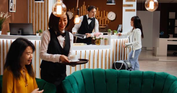 istock Asian woman asking receptionist about room reservation 1937581565