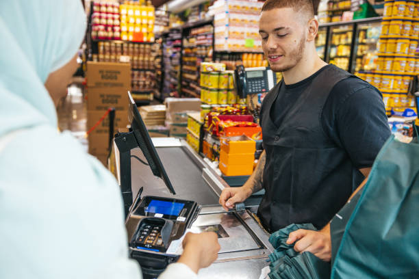 istock Customer paying in a Grocery Store 1937583142