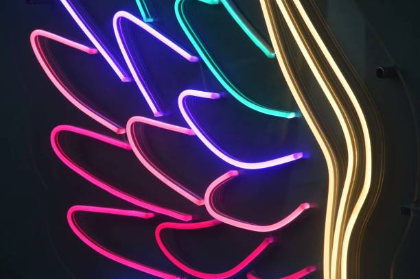 istock Colorful neon stripes, colored elements. Bright glowing curved lines on a black background. Abstract background. 1937591676