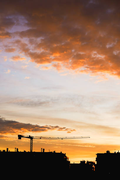 istock city silhouette and crane. 1937610196