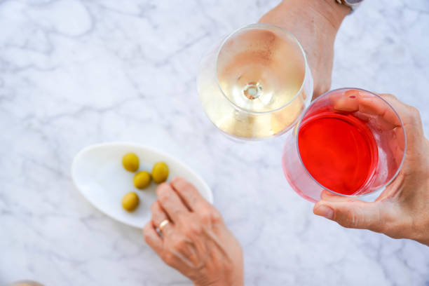istock Group of unrecognizable friends having a drink and spending the day outdoors on a terrace 1937610375