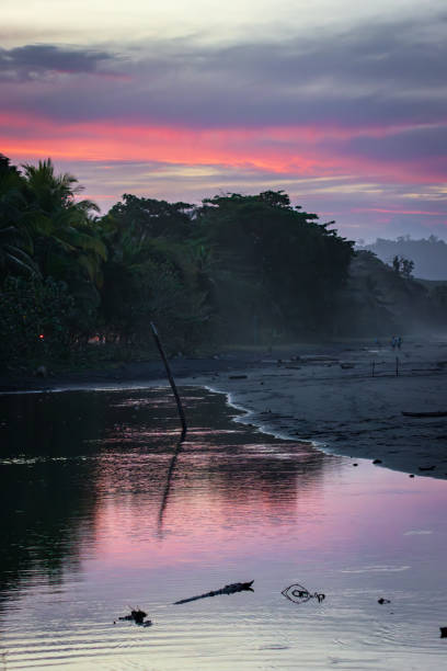 Sunset from black beach in Puerto Viejo de Talamanca (Costa Rica)
